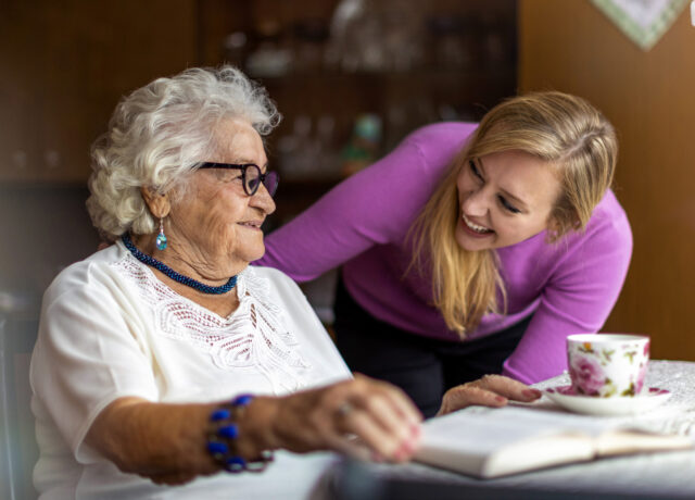 Younger lady talking to older lady